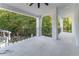 Spacious balcony with wrought iron railings and views of the wooded backyard at 3915 Muirfield Sq, Duluth, GA 30096