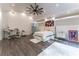 Spacious bedroom with high ceilings, hardwood floors and large windows at 3915 Muirfield Sq, Duluth, GA 30096