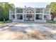Stunning two story house with stone patio and lush green lawn at 3915 Muirfield Sq, Duluth, GA 30096