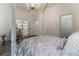 Main bedroom with a four poster bed and access to a private balcony at 3915 Muirfield Sq, Duluth, GA 30096