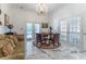 Spacious home office featuring a marble floor and French doors at 3915 Muirfield Sq, Duluth, GA 30096