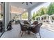 Covered patio with seating area and views of the outdoor kitchen at 3915 Muirfield Sq, Duluth, GA 30096
