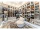 Luxurious walk-in closet with custom built-ins at 3915 Muirfield Sq, Duluth, GA 30096