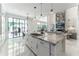 Luxury kitchen with large island and open floor plan at 3915 Muirfield Sq, Duluth, GA 30096
