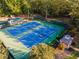 Two tennis courts with surrounding trees and a gazebo at 3915 Muirfield Sq, Duluth, GA 30096