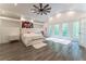 Spacious bedroom with high ceilings, hardwood floors and large windows at 3915 Muirfield Sq, Duluth, GA 30096