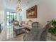 Elegant living room features a marble floor, ornate furniture, and a view to the backyard at 3915 Muirfield Sq, Duluth, GA 30096