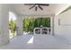 Covered balcony overlooking the backyard with a ceiling fan at 3915 Muirfield Sq, Duluth, GA 30096