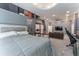 Main bedroom with sitting area, home gym and private balcony at 3915 Muirfield Sq, Duluth, GA 30096