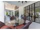 Outdoor patio with seating area and glass doors leading inside at 3915 Muirfield Sq, Duluth, GA 30096