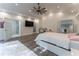Spacious bedroom with ensuite bathroom and large TV at 3915 Muirfield Sq, Duluth, GA 30096