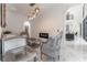 Bright living room with marble floors, comfortable seating, and a view into the kitchen at 3915 Muirfield Sq, Duluth, GA 30096