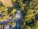 Aerial view of house, neighborhood, and green space at 3915 Muirfield Sq, Duluth, GA 30096