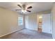 Bright bedroom featuring a ceiling fan and en-suite bathroom access at 3891 Northstrand Dr, Decatur, GA 30035