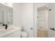 Modern bathroom with white vanity, quartz countertop, and black fixtures at 3900 Hilton Cts, Decatur, GA 30035
