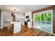 Renovated kitchen, island, stainless steel appliances, and deck view at 3900 Hilton Cts, Decatur, GA 30035