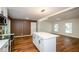 Open concept kitchen with white island and hardwood floors at 3900 Hilton Cts, Decatur, GA 30035