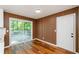 Bright dining area with wood accent wall and deck access at 3900 Hilton Cts, Decatur, GA 30035