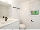 Clean bathroom with white vanity, quartz countertop, and window at 3900 Hilton Cts, Decatur, GA 30035