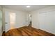 Bedroom with wood-look floors, private bath access, and double closets at 3900 Hilton Cts, Decatur, GA 30035