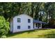 Charming two-story home with white brick exterior and a landscaped yard at 3900 Hilton Cts, Decatur, GA 30035