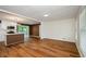 Open concept living area with hardwood floors and kitchen view at 3900 Hilton Cts, Decatur, GA 30035