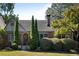 Brick house with a classic design, manicured lawn, and mature trees at 1273 Oakdale Ne Rd, Atlanta, GA 30307