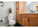 Updated bathroom with wood vanity, hexagon tile, and walk-in shower at 1336 Mcclelland Ave, Atlanta, GA 30344