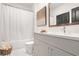 Clean bathroom with a bathtub, shower, updated vanity, and stylish fixtures at 391 Pratt Se Dr # 704, Atlanta, GA 30315