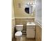 Small bathroom with beige tile and white vanity at 207 Howell Dr, Atlanta, GA 30331
