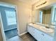 Double vanity bathroom with modern finishes at 1381 Buckingham Dr, Hampton, GA 30228