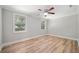 Bright bedroom with ceiling fan, new flooring, and neutral walls at 1291 Sommerset Dr, Lawrenceville, GA 30043