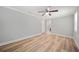 Bedroom with wood-look floors and ceiling fan at 1291 Sommerset Dr, Lawrenceville, GA 30043