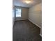 Large walk-in closet with double hanging rods and a window at 1231 Sweetgum Trl, Conyers, GA 30012