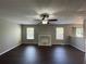 Living room with hardwood floors, fireplace and ceiling fan at 3996 Kenner Sw Dr, Atlanta, GA 30331