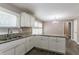 Eat-in kitchen with white cabinets and granite countertops at 2362 Manor Ave, Atlanta, GA 30344