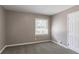 Well-lit bedroom with carpet, neutral walls, and a window at 2362 Manor Ave, Atlanta, GA 30344