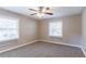 Cozy bedroom with neutral walls, ceiling fan, and carpet flooring at 2362 Manor Ave, Atlanta, GA 30344