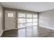 Bright living room with hardwood floors and large windows at 2362 Manor Ave, Atlanta, GA 30344
