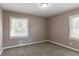 Bedroom with neutral walls, carpet flooring and window with blinds at 2362 Manor Ave, Atlanta, GA 30344
