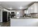 Modern kitchen with white cabinets, granite counters, and stainless steel appliances at 2362 Manor Ave, Atlanta, GA 30344