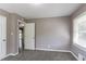 Simple bedroom with carpet, neutral walls, and window with blinds at 2362 Manor Ave, Atlanta, GA 30344