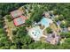 Resort-style pool, tennis courts, and clubhouse in a community setting at 7276 Eton Ln, Locust Grove, GA 30248