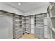 Large walk-in closet with ample shelving and hanging space at 5255 Buice Rd, Alpharetta, GA 30022