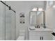 Modern bathroom with marble shower and white vanity at 5255 Buice Rd, Alpharetta, GA 30022