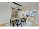 Open dining area with hardwood floors and view into living room at 5255 Buice Rd, Alpharetta, GA 30022