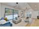 Living area with hardwood floors, modern decor, and access to backyard at 5255 Buice Rd, Alpharetta, GA 30022