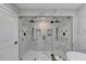 Large walk-in shower with double shower heads and marble surround at 5255 Buice Rd, Alpharetta, GA 30022