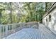 Large deck with wooded backdrop; perfect for outdoor living at 5255 Buice Rd, Alpharetta, GA 30022