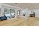 Bright living room with hardwood floors, fireplace and large windows at 5255 Buice Rd, Alpharetta, GA 30022